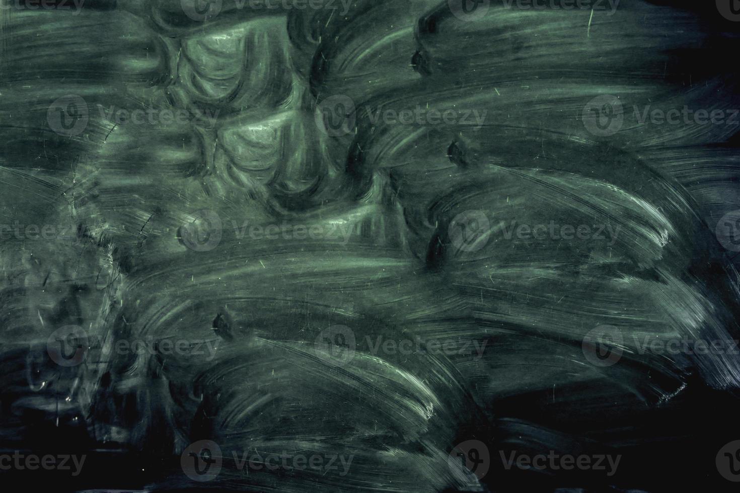 Dark green vintage background of blurred paint spots with cracks and scratches. Mystical green background. Black blue green abstract art background. photo