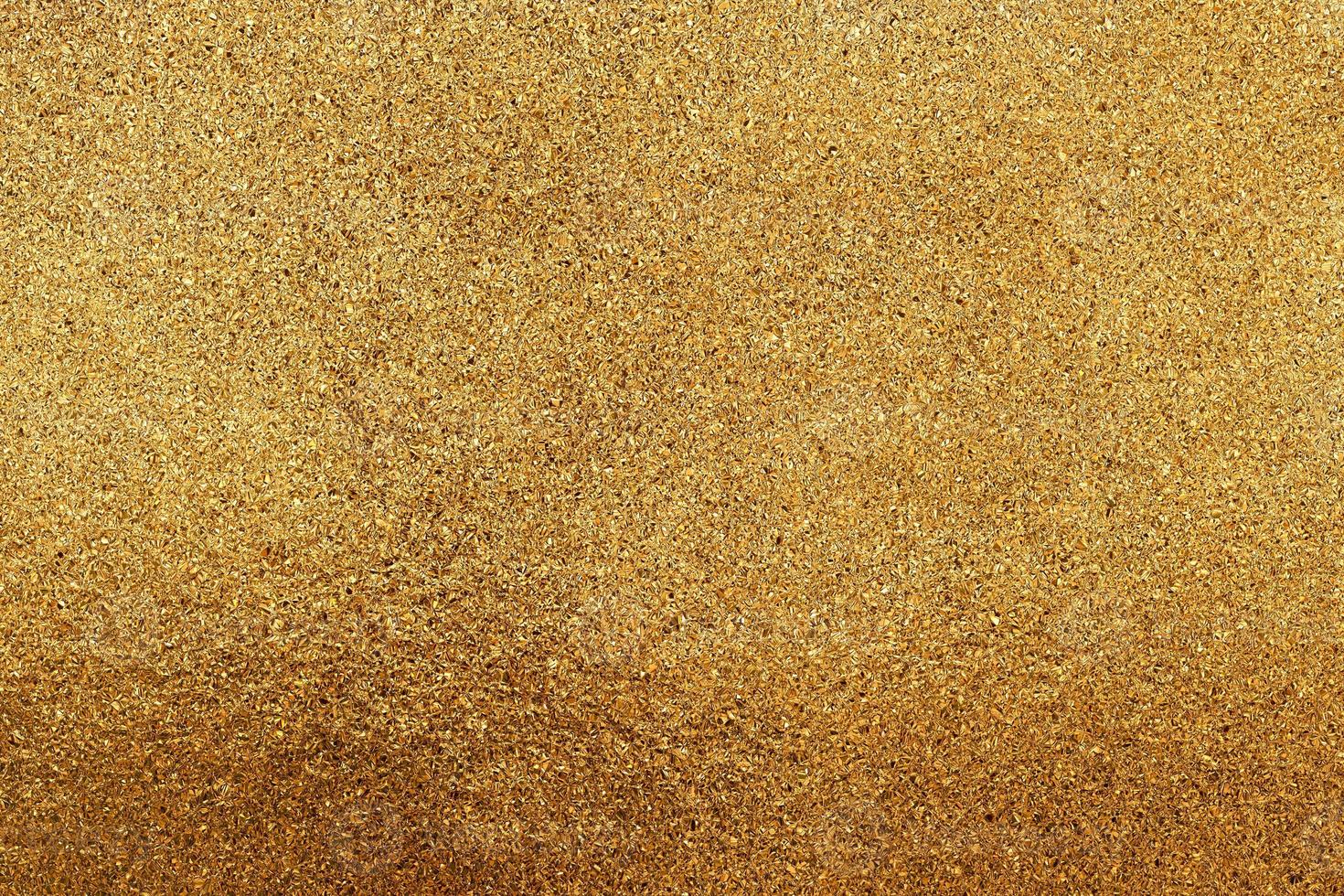 The texture of small gold chips or glitter. photo