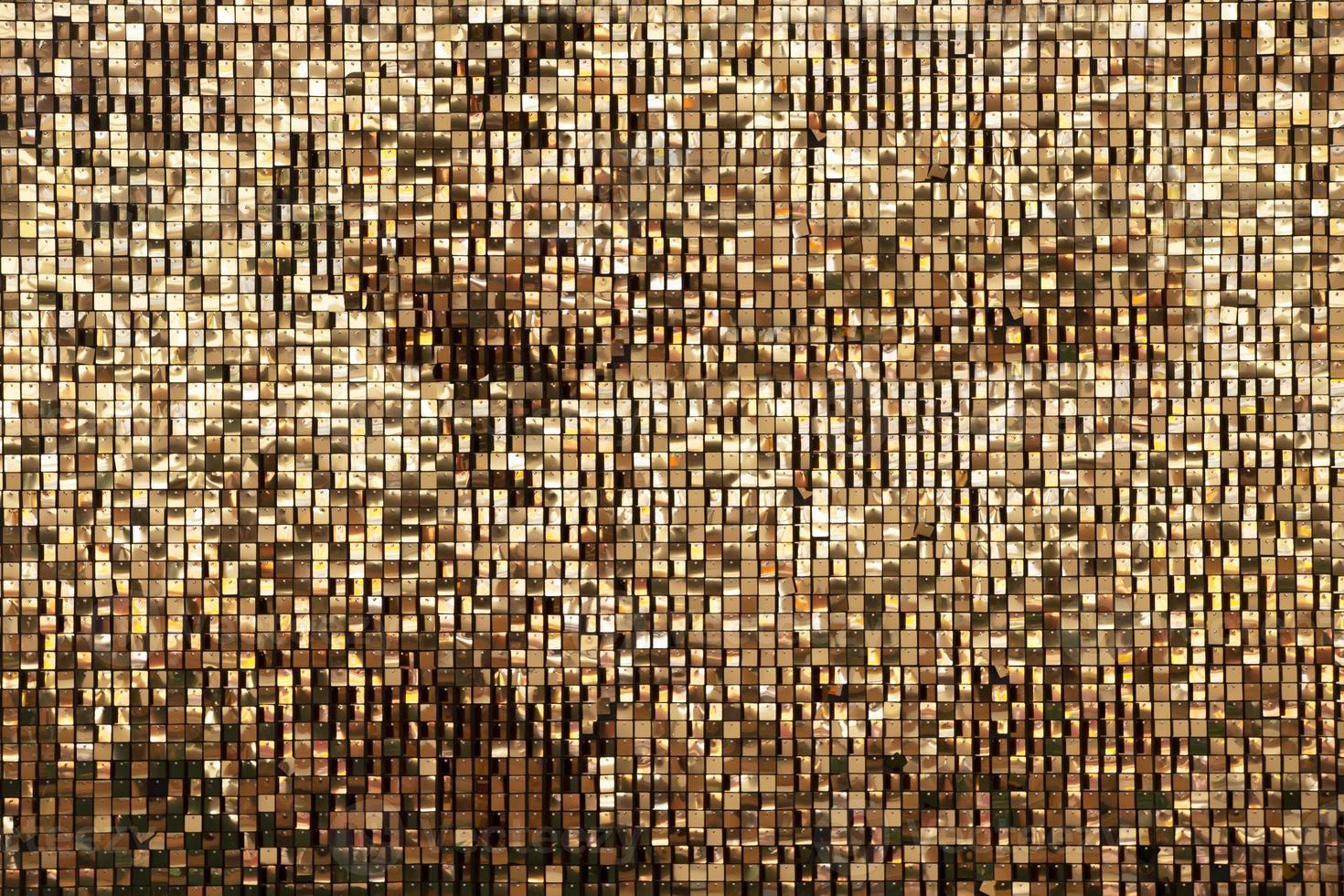 Golden rainbow background from small squares. Iridescent golden glass texture background. Multicolored icy shiny crystal texture. Abstract iridescent texture. photo