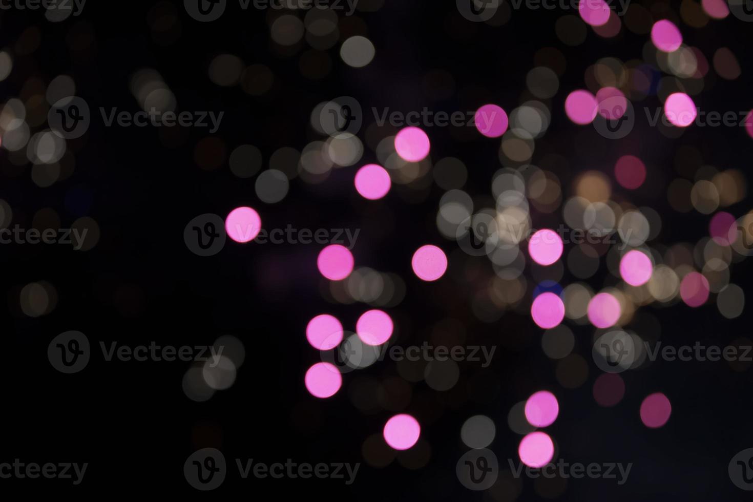 On a black background bokeh from explosions of colorful fireworks. photo