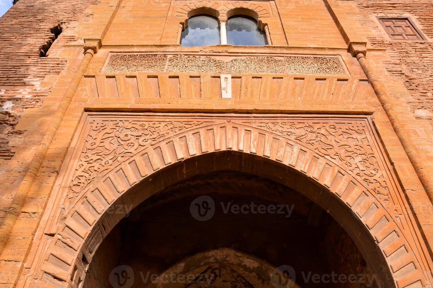 Intricate carved archway photo