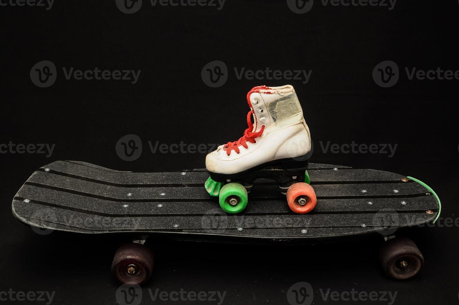 White skates and skateboard photo
