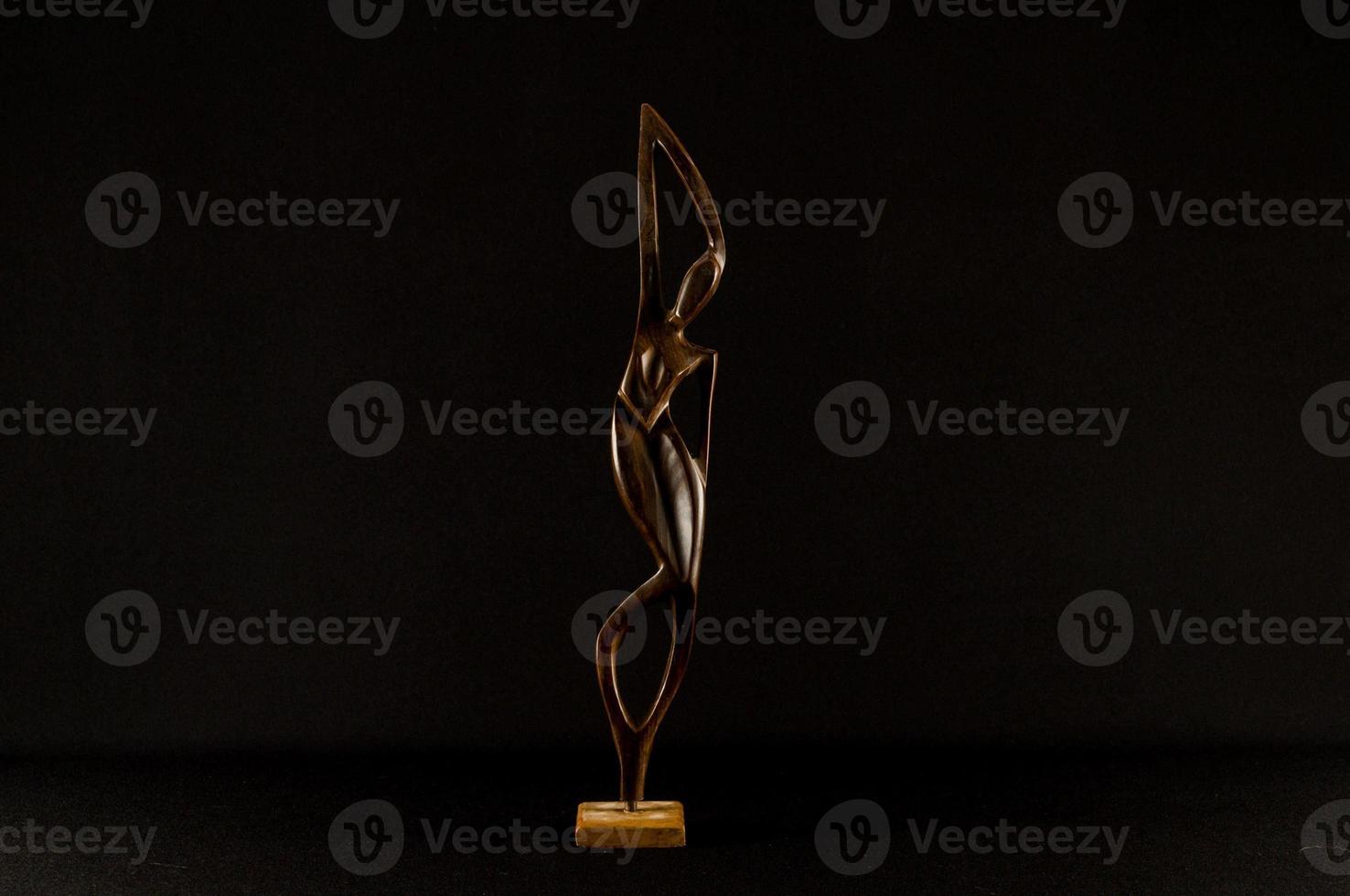Small sculpture on black background photo
