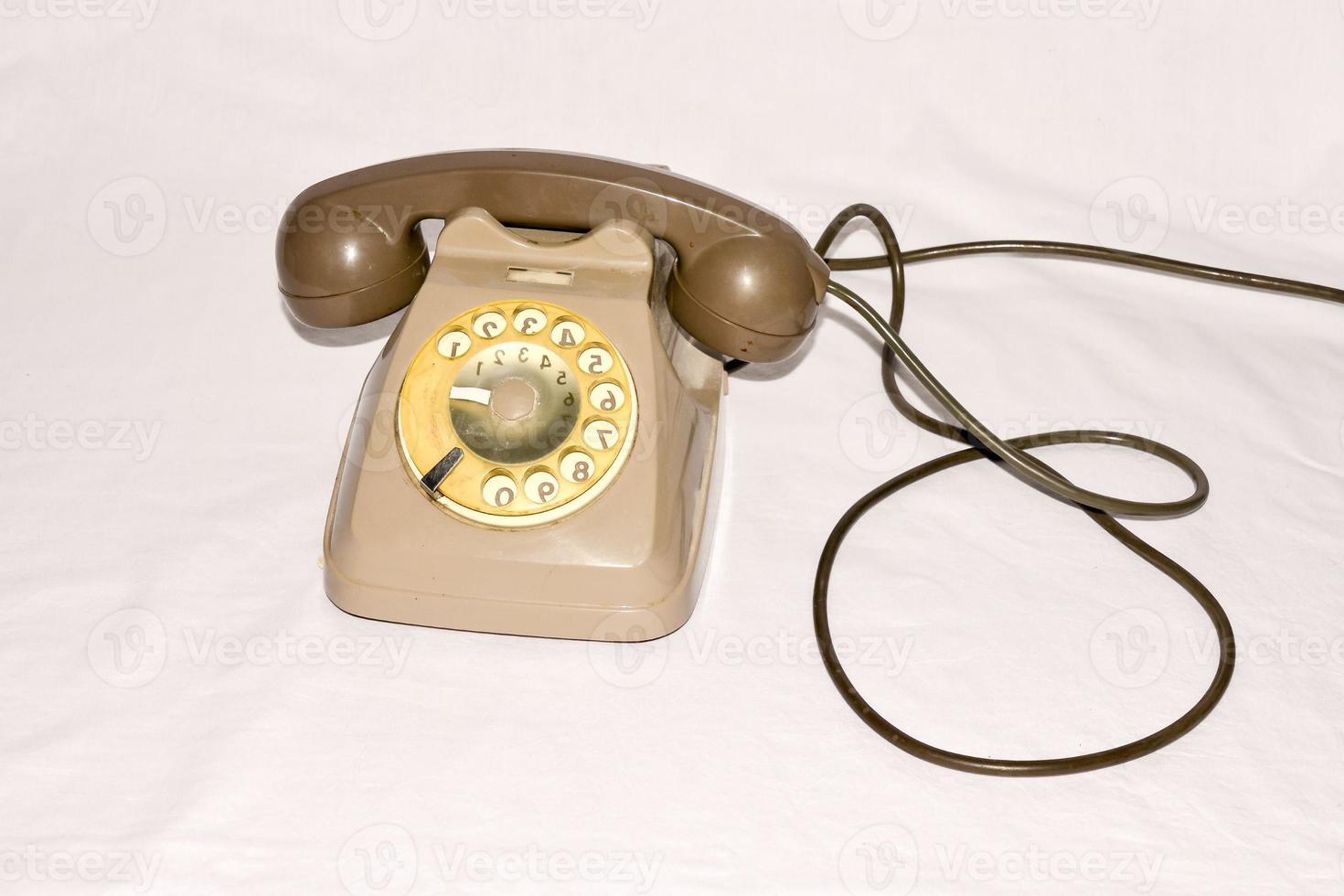 Old telephone on white background photo