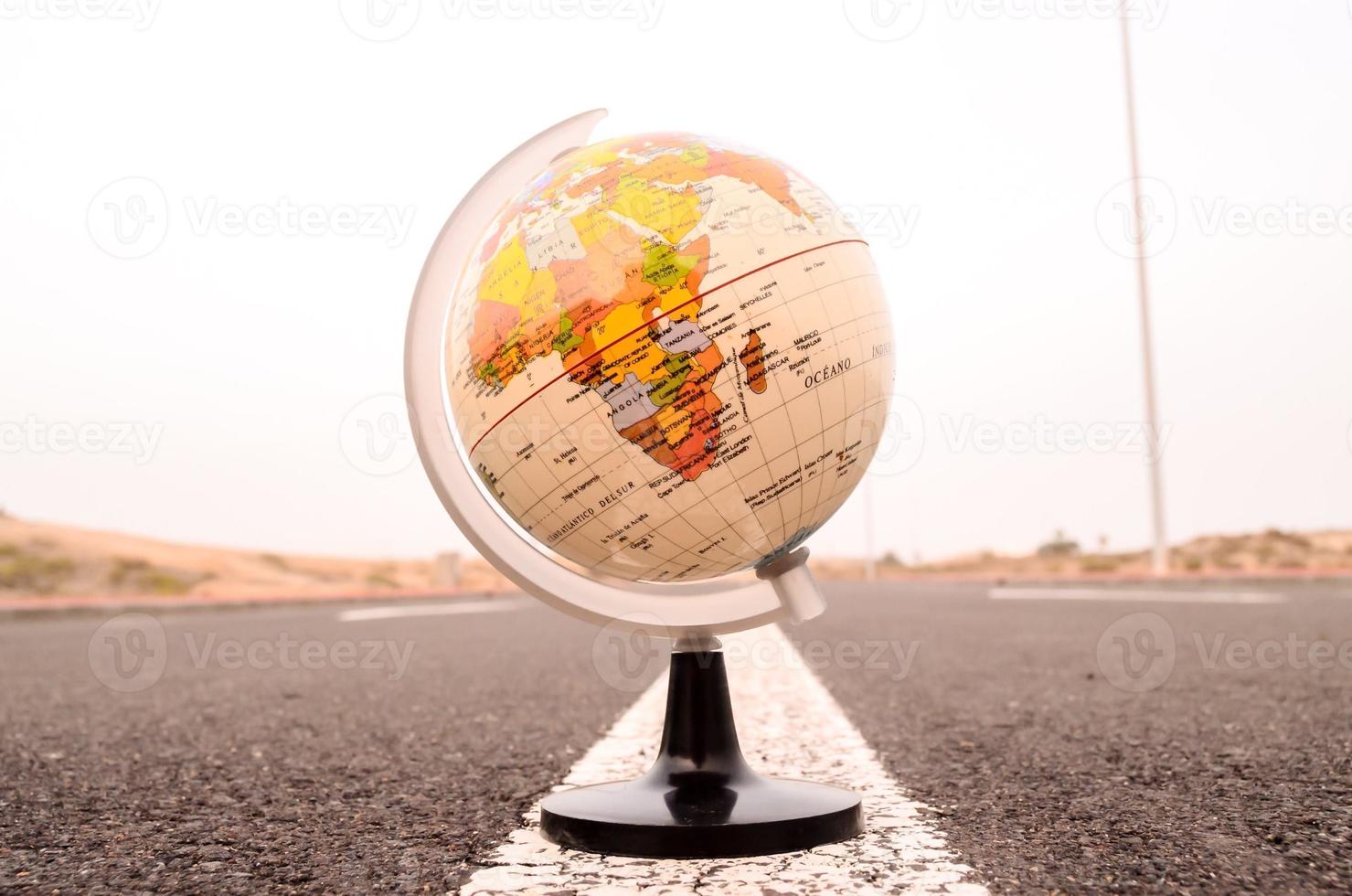 Globe on the road photo