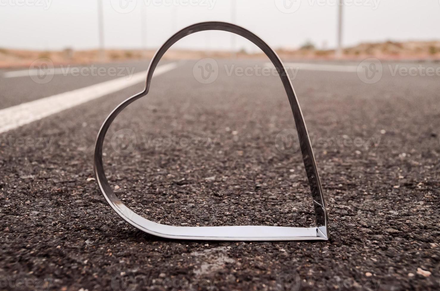 Metal heart on the road photo