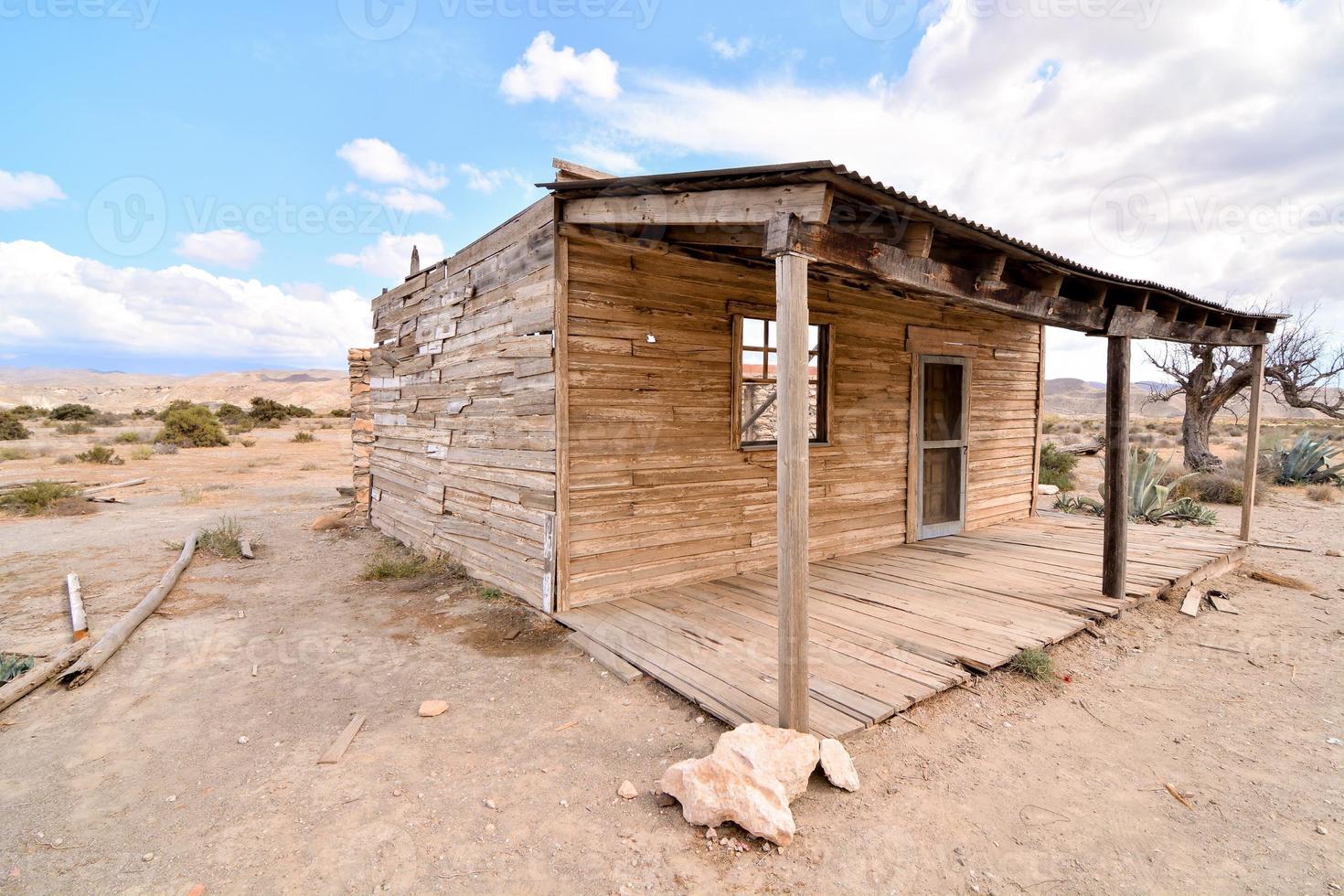 Abandoned cabin in the desert photo