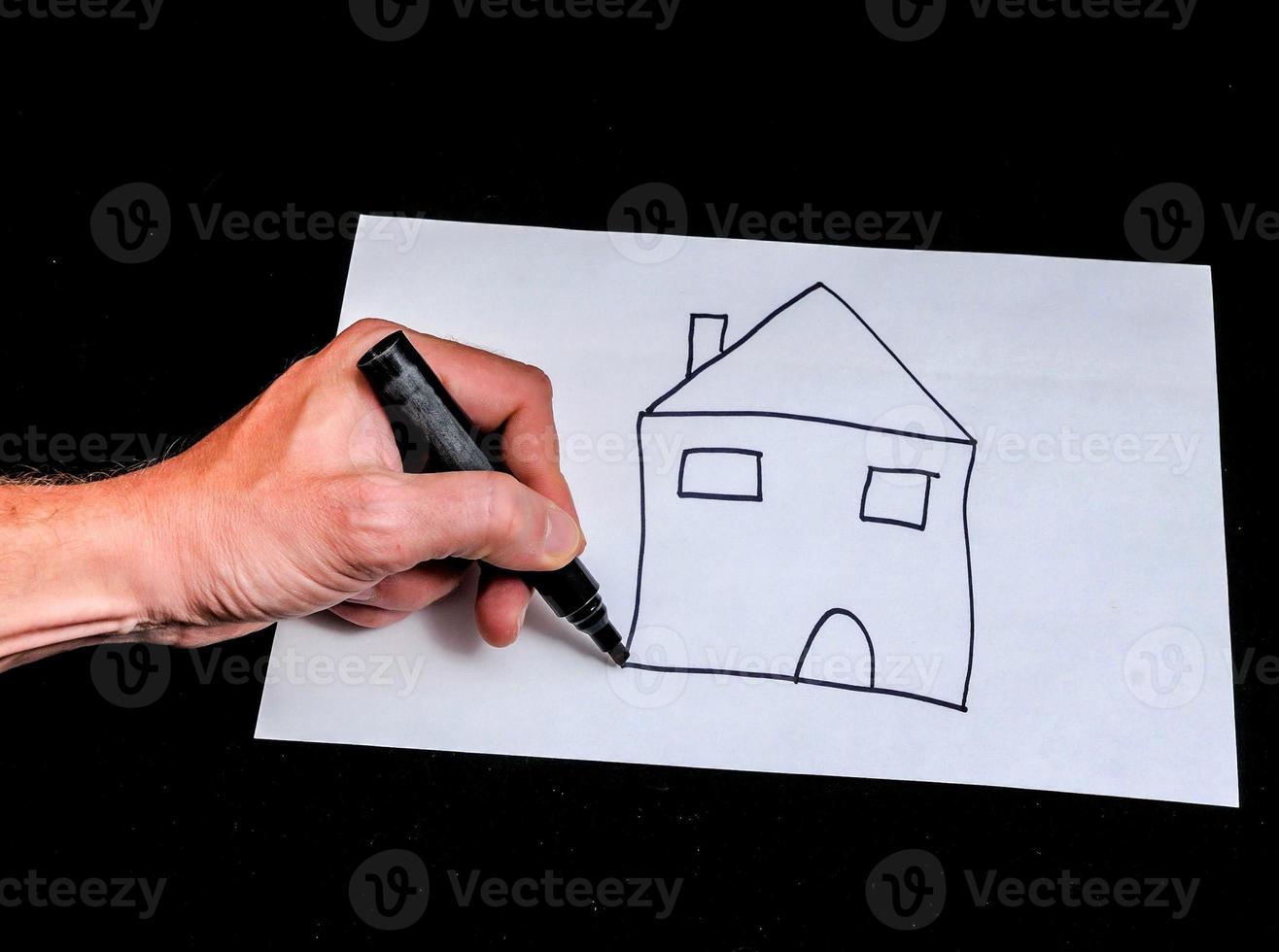 Hand drawing a simple house photo