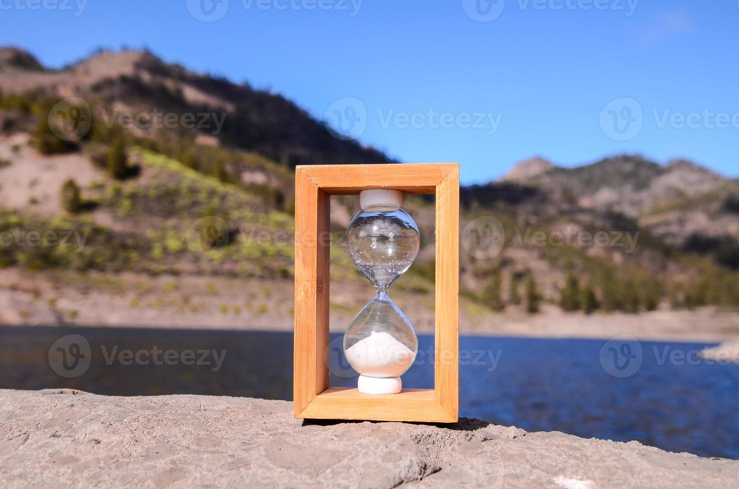 Hourglass by the sea photo