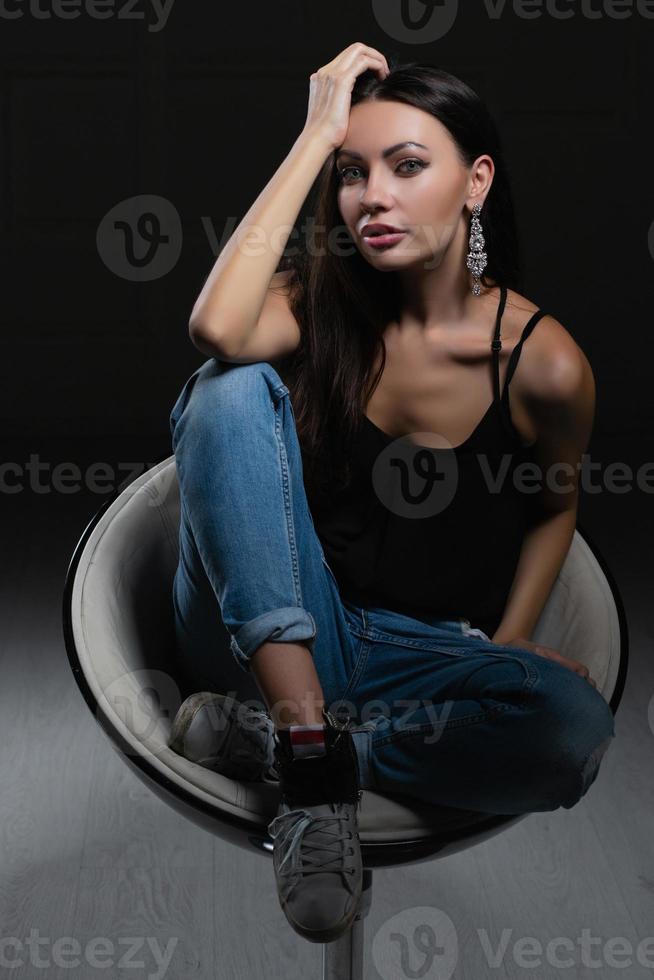 Nice young lady on a black background photo