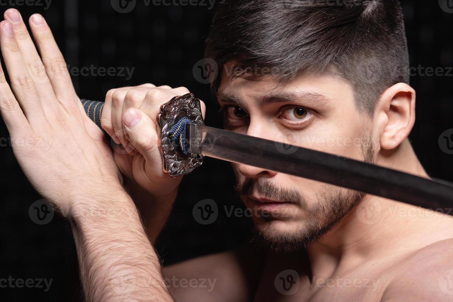 Portrait of handsome guy posing in studio photo