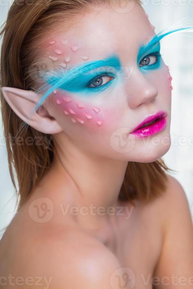 Charming girl in the image of an elf photo