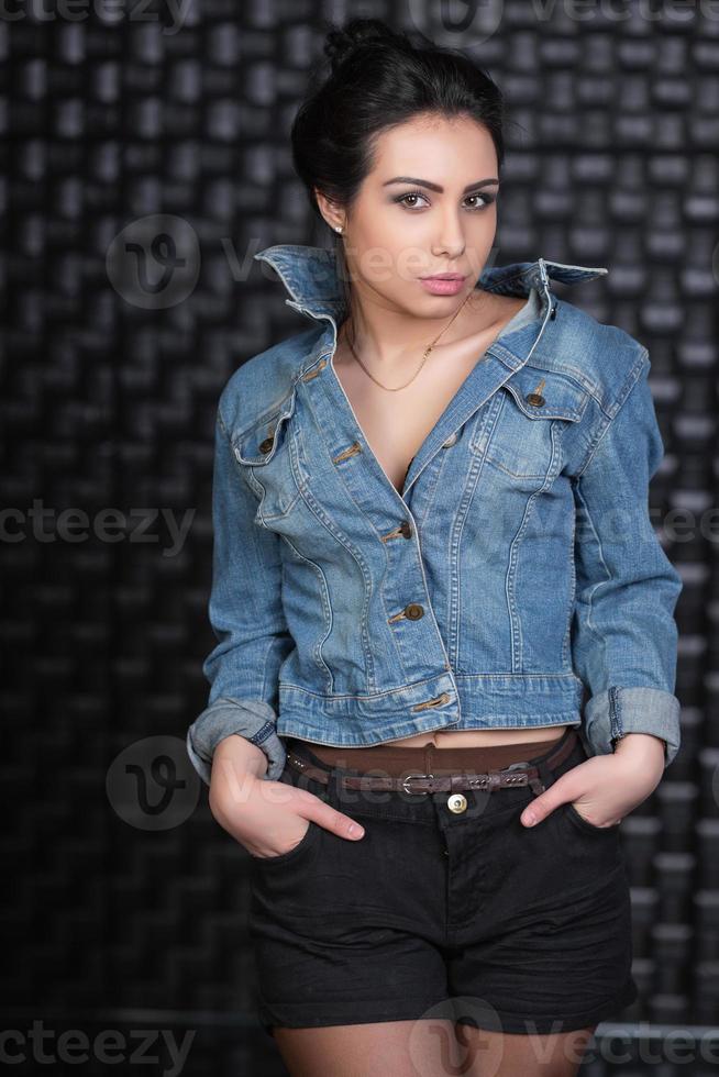 Attractive brunette posing in the studio photo