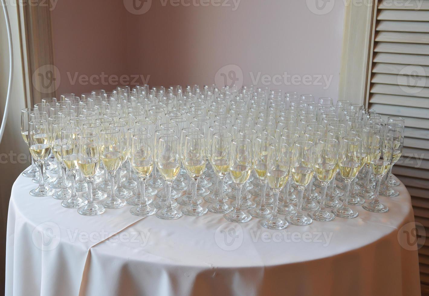 champagne glasses arranged on the table for wedding reception photo
