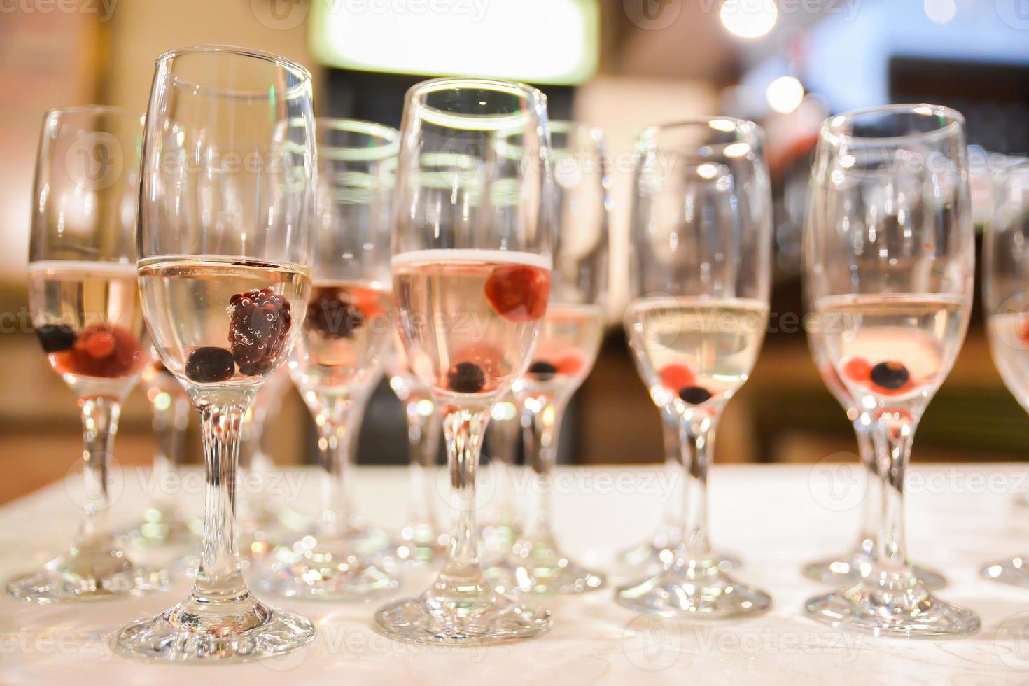 champagne glasses arranged on the table for wedding reception photo