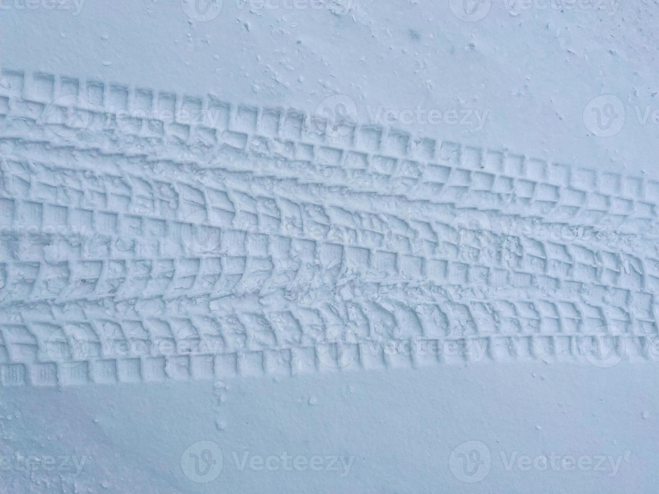 Winter road, Christmas trees in the snow. A track in a winter snow scene. Snowy, evening. photo