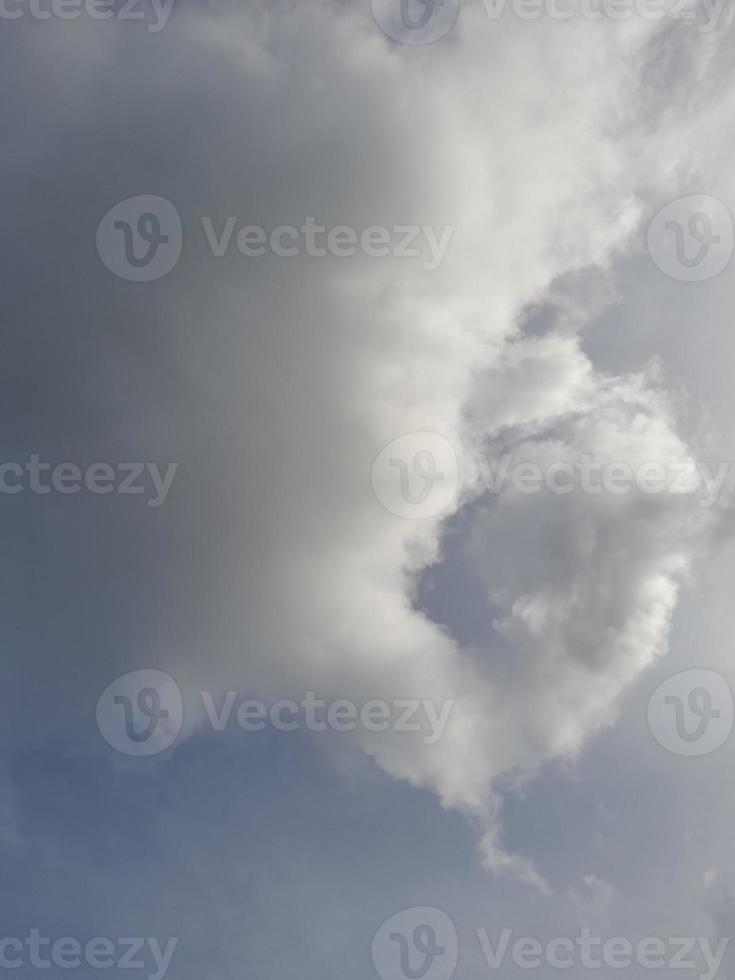 Beautiful white clouds on deep blue sky background. Large bright soft fluffy clouds are cover the entire blue sky. photo