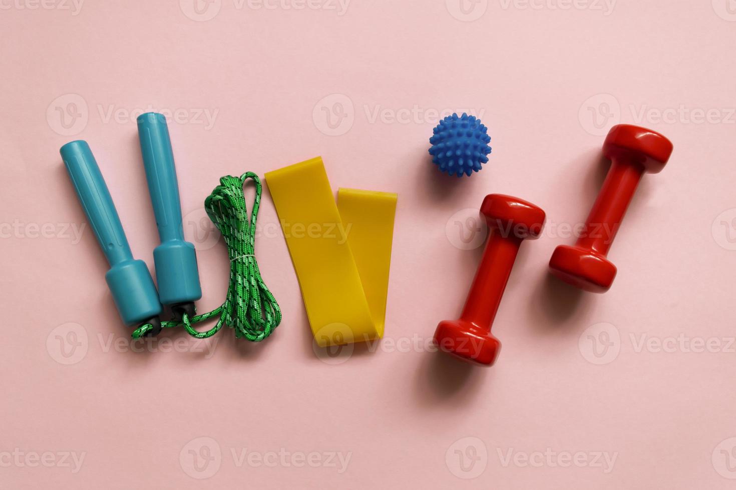 Sport, fitness equipment on pink background. Flat lay composition photo