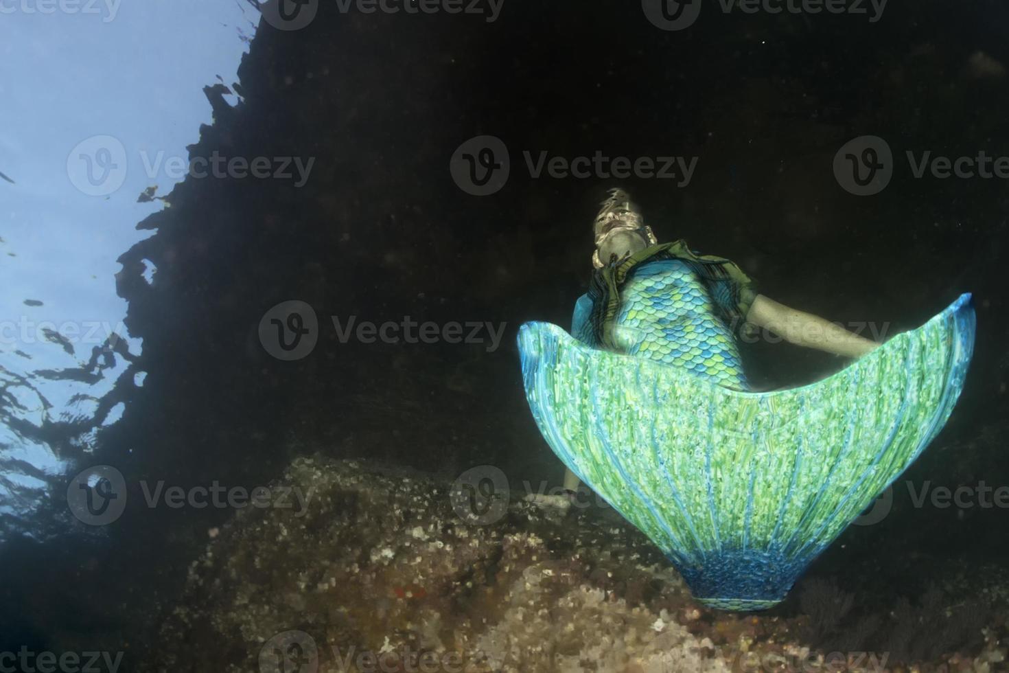 Mermaid meeting a diver underwater photo