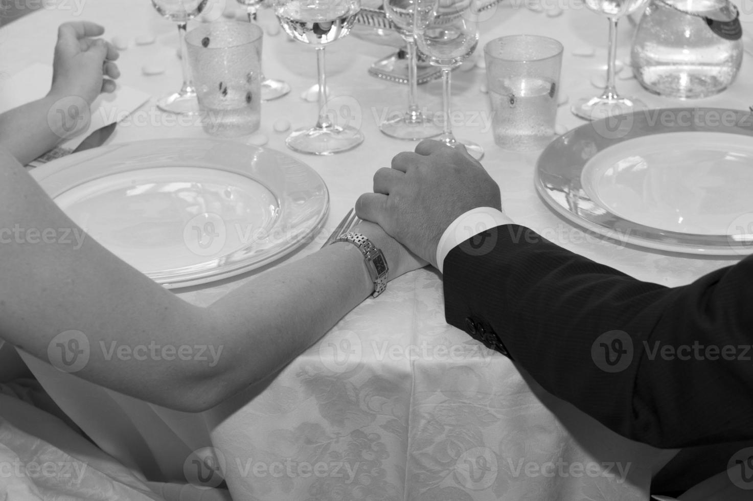 Wedding crossed hands in black and white photo