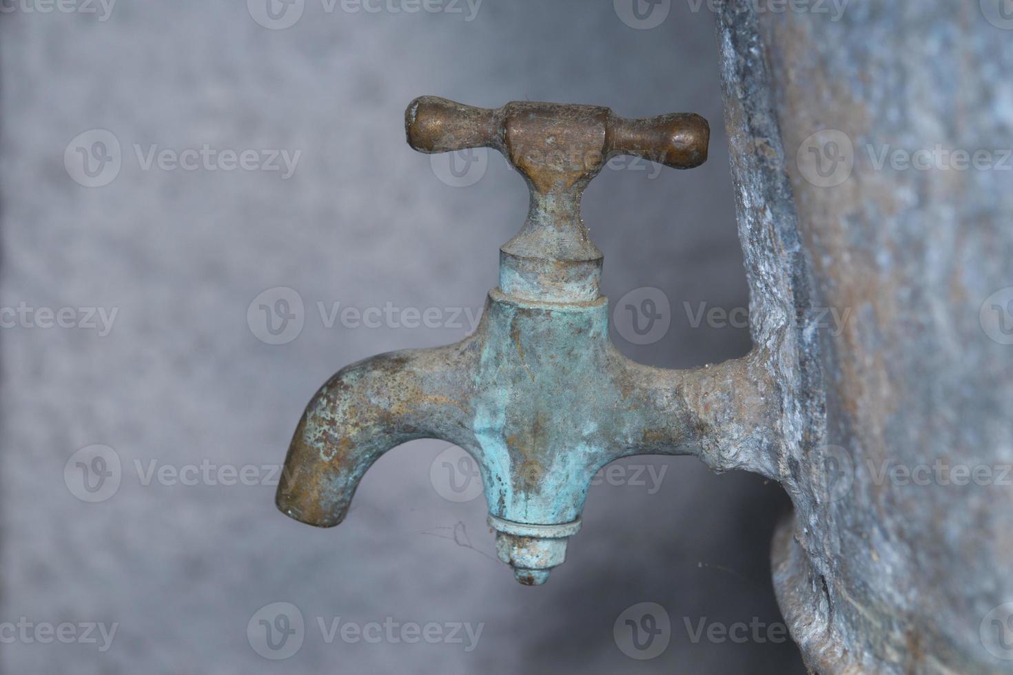 Vintage zinc tap faucet used for grape harvest and wine photo