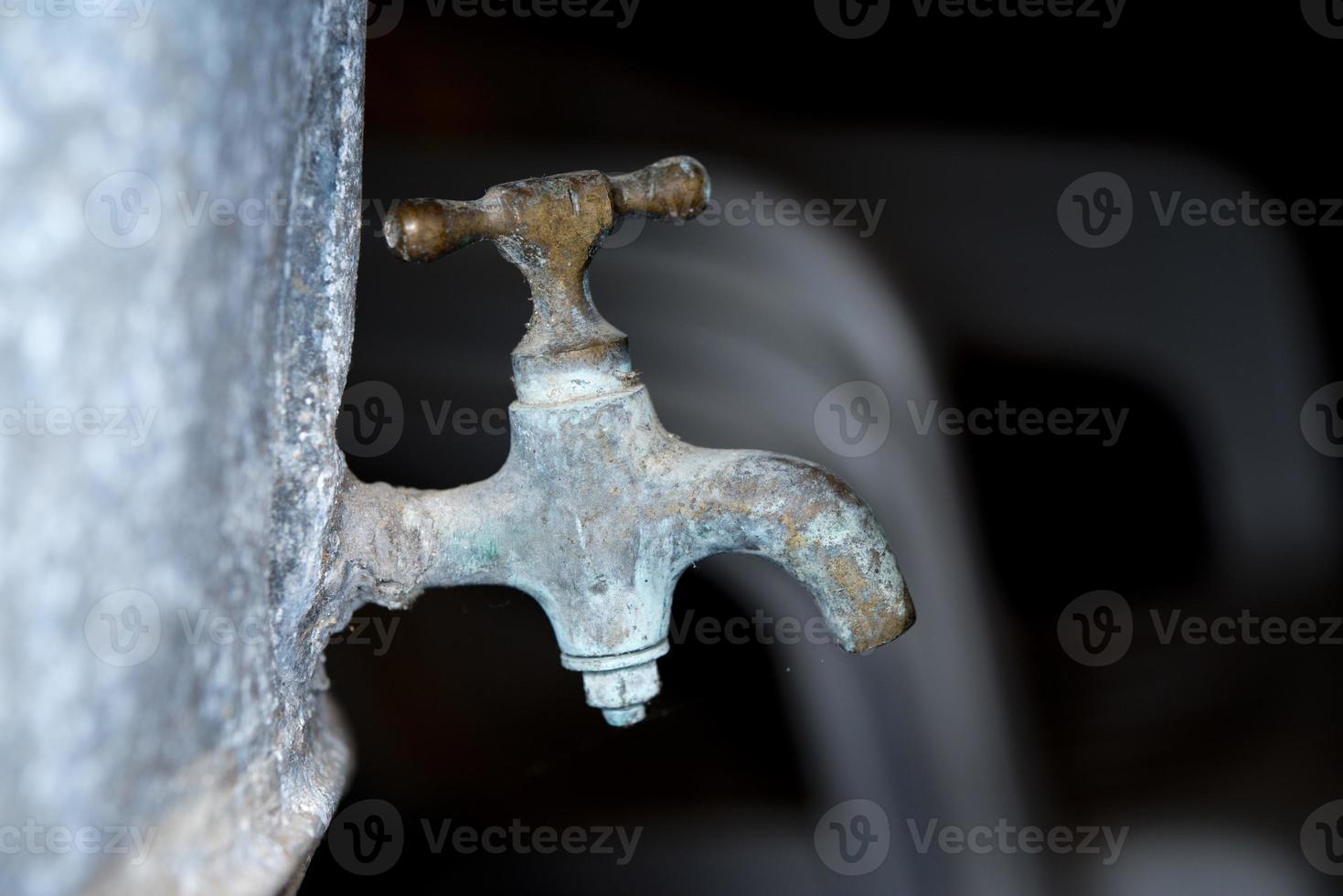 Vintage zinc tap faucet used for grape harvest and wine photo