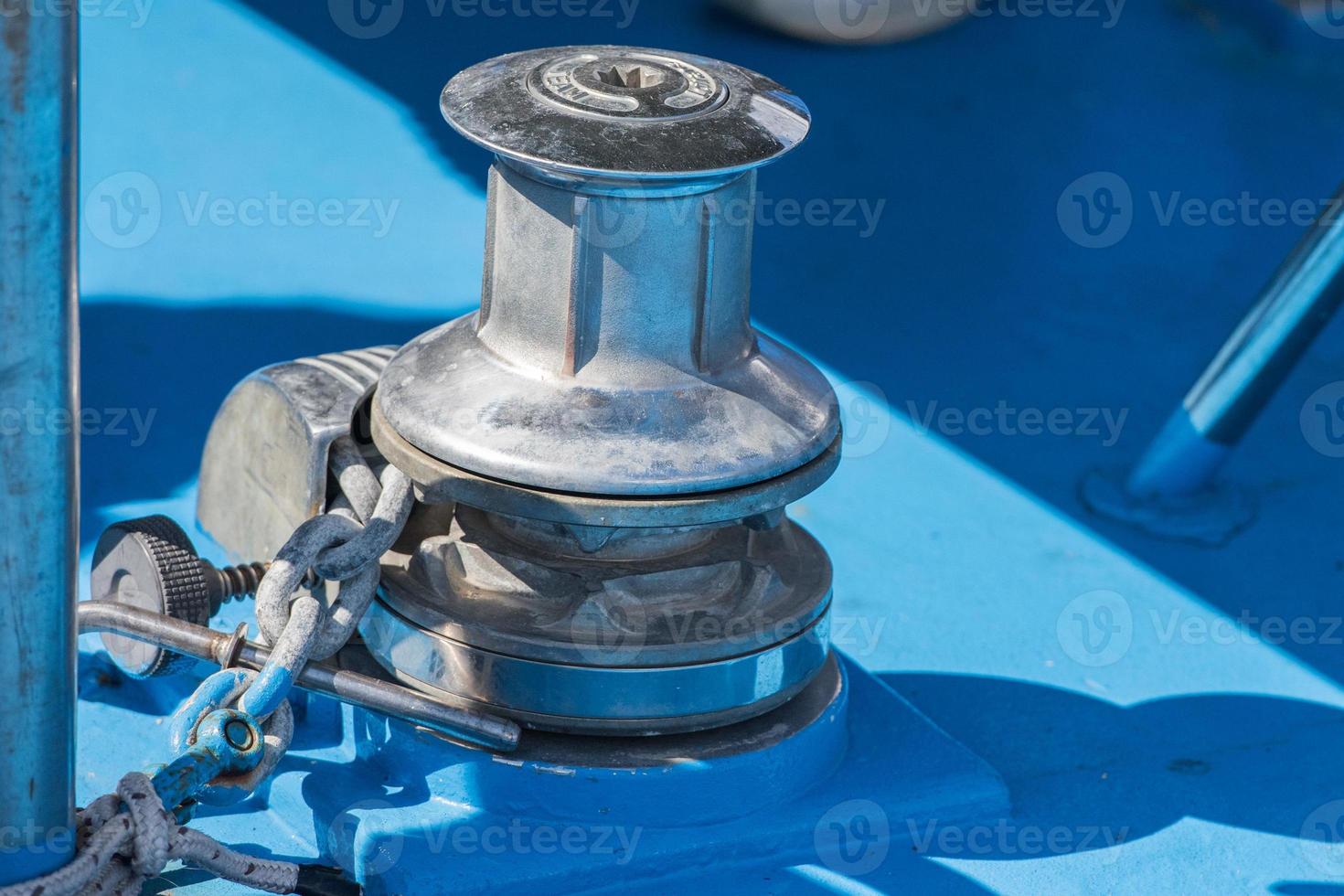 boat metal winch detail on blue background photo