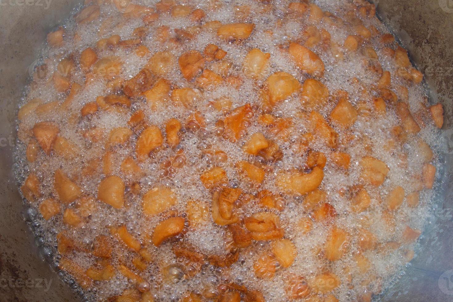 A deep fry fying pan close up very hot with chips photo