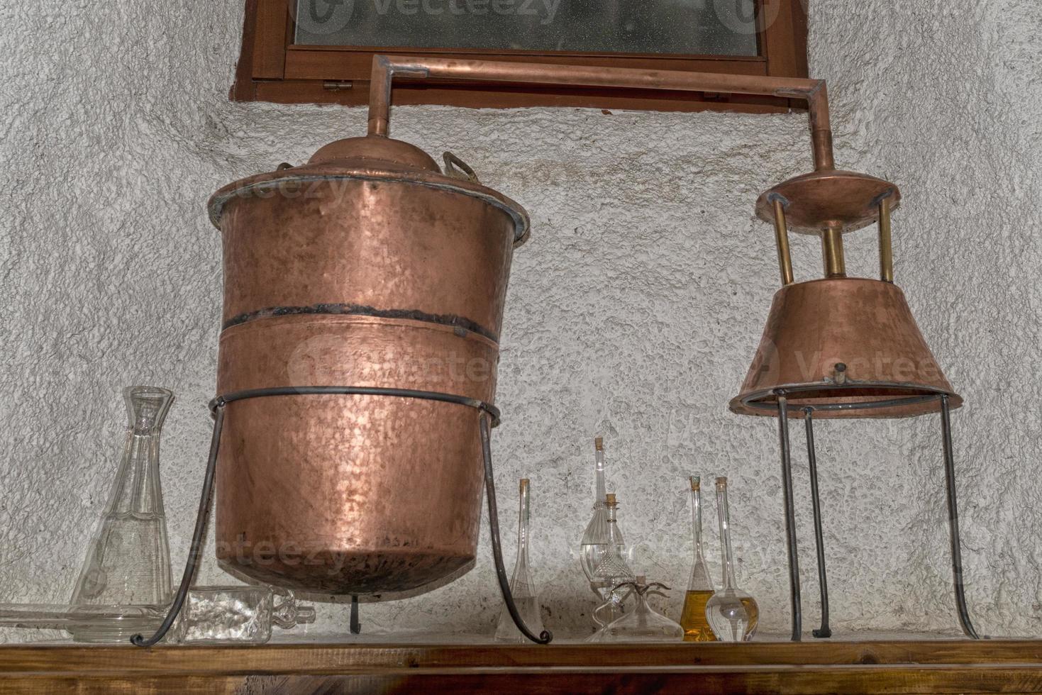 Copper still alembic inside distillery photo