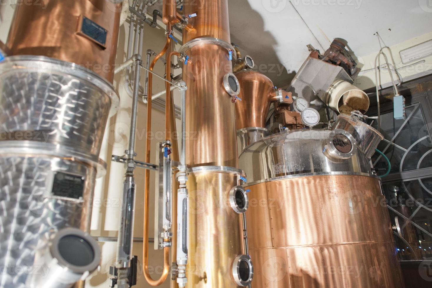 Copper still alembic inside distillery photo