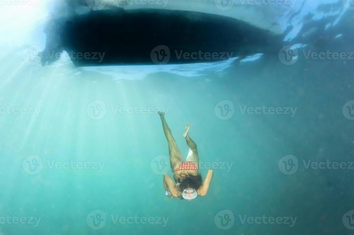 beautiful girl diving and coming to you photo