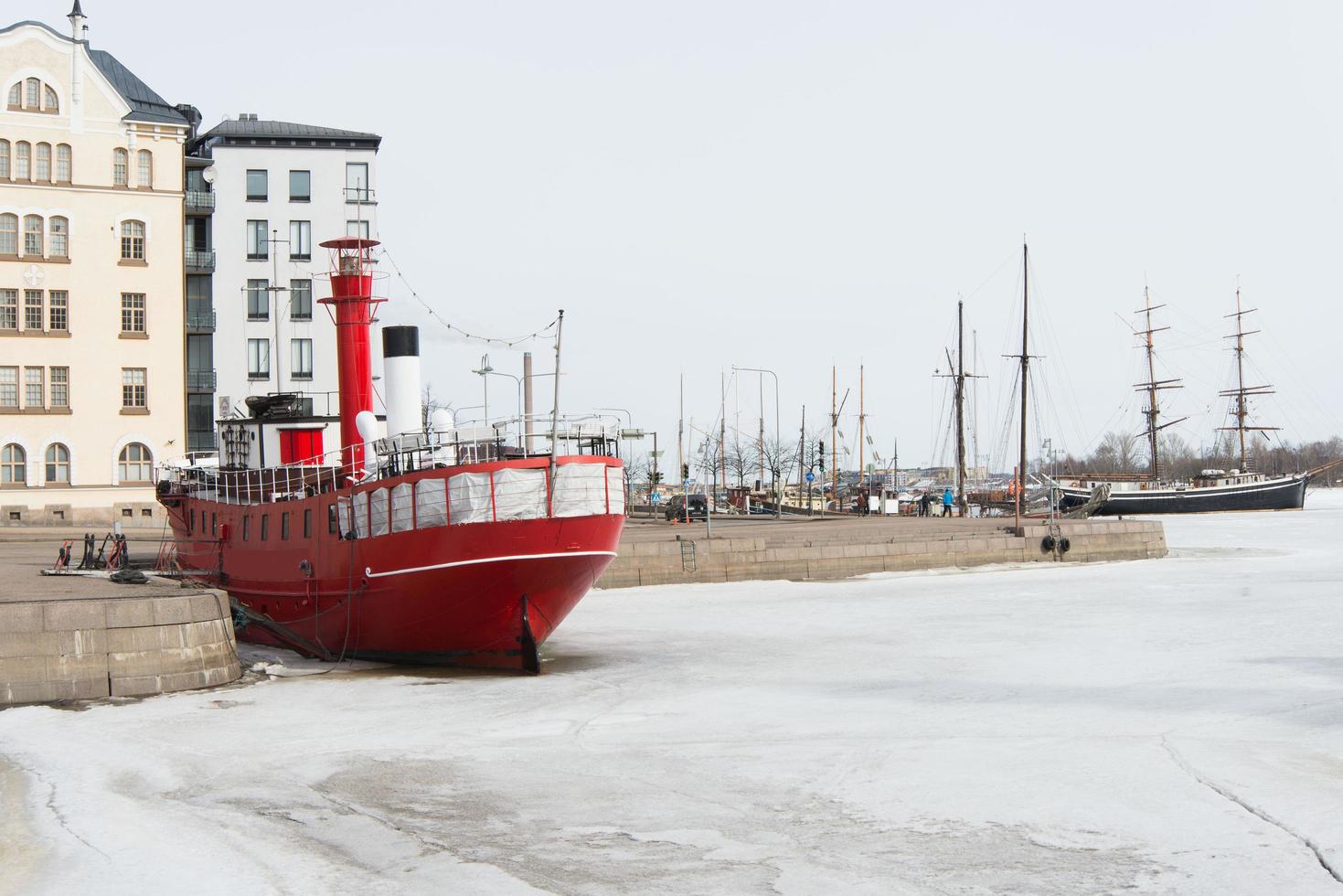 Red ship at iced Helsinki harbour. Finland photo