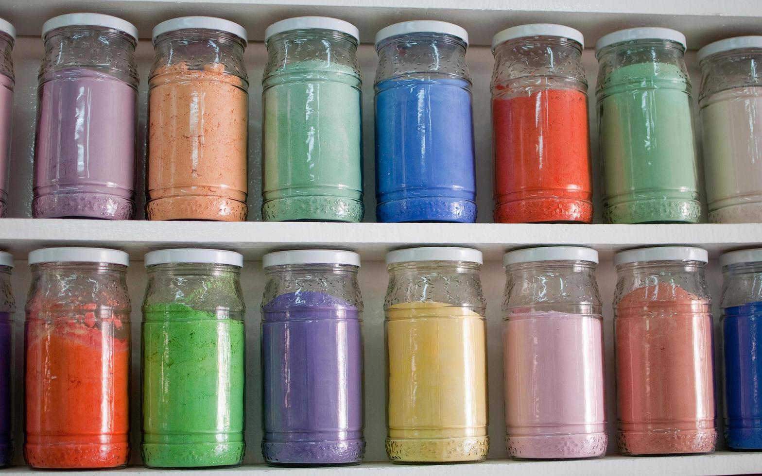 Shelf with multicolored glass jars. Marrakech photo