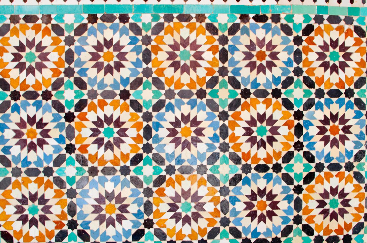 Background. Tiles with floral pattern in blue and orange. photo