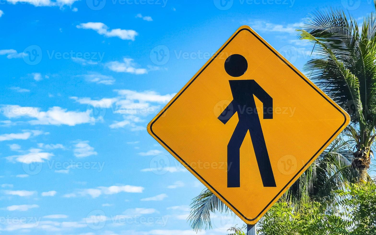 Yellow pedestrian sign street sign in Puerto Escondido Mexico. photo