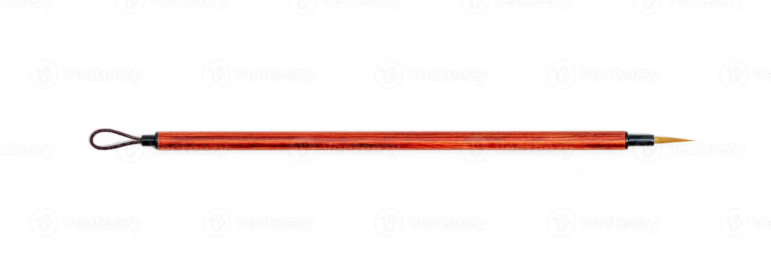 Chinese bamboo brushes. Red watercolor paint brushes on white. Pointed brushes. photo