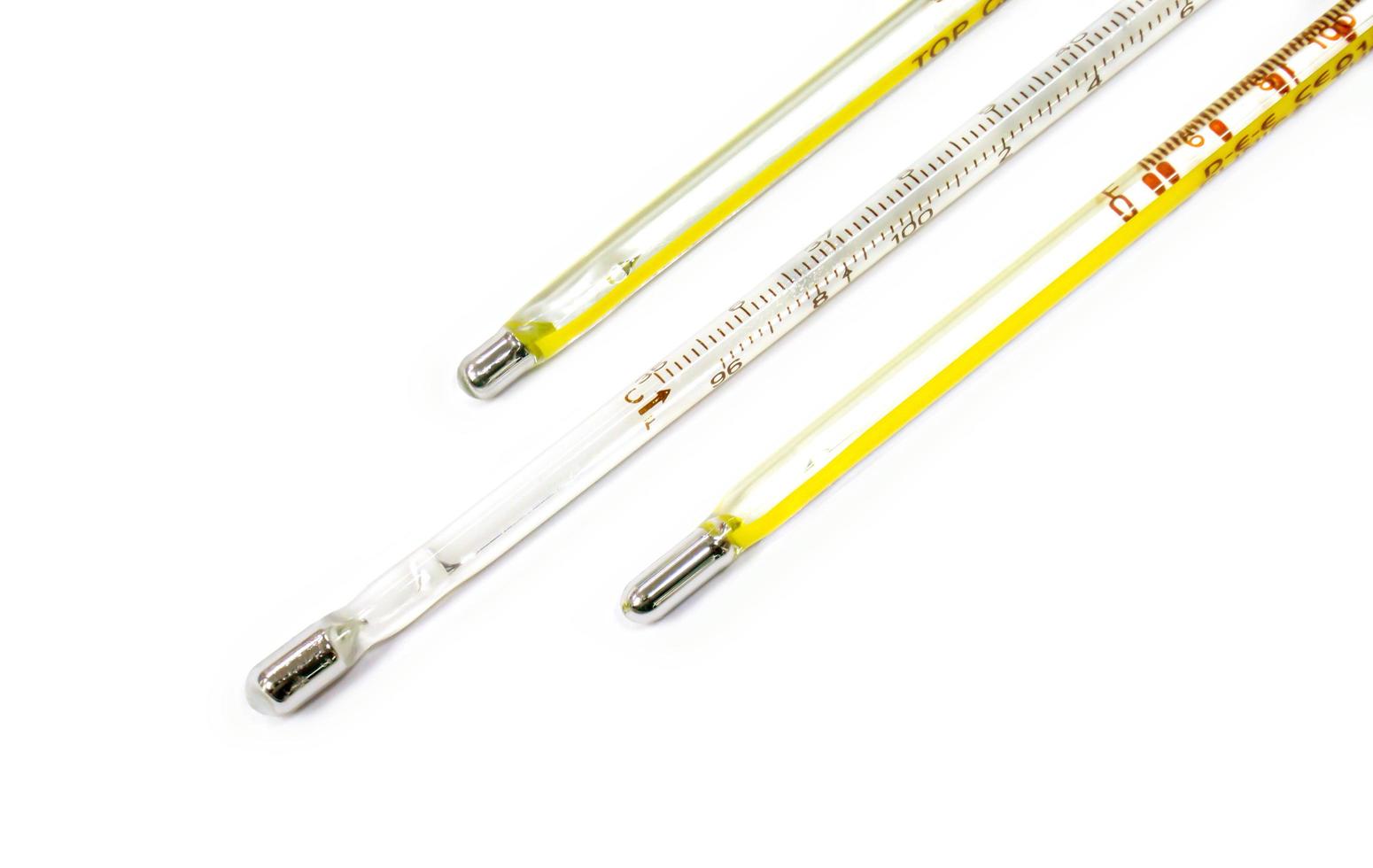 Closeup and crop small medical thermometers line up isolate on white background. photo