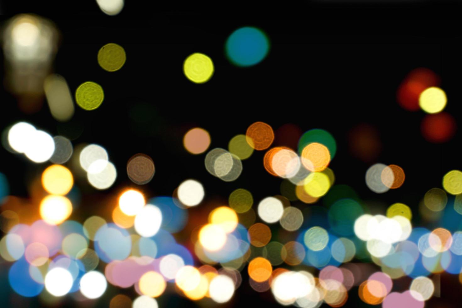Abstract colorful bokeh and blurred reflection lighting on black background photo