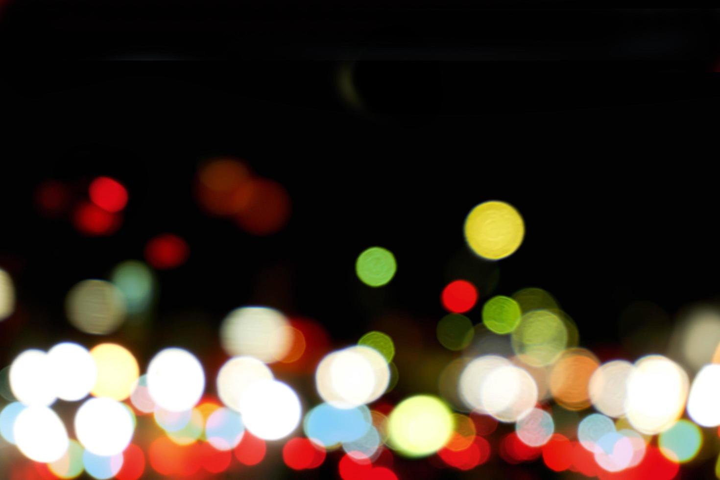 Abstract colorful bokeh and blurred reflection lighting on black background photo