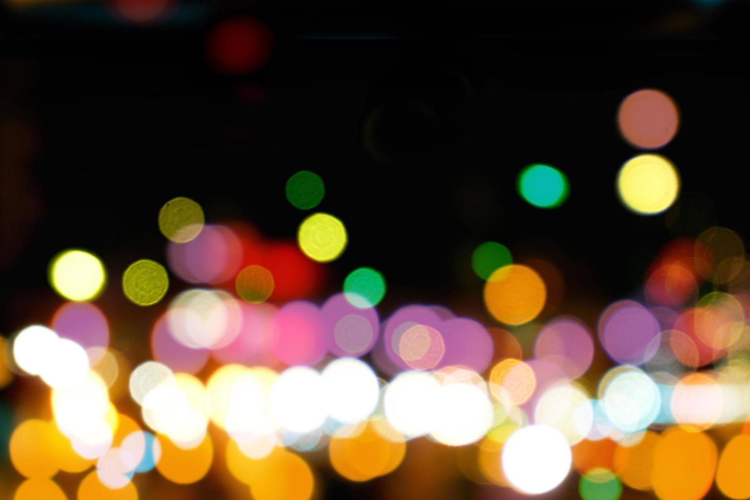 Abstract colorful bokeh and blurred reflection lighting on black background photo