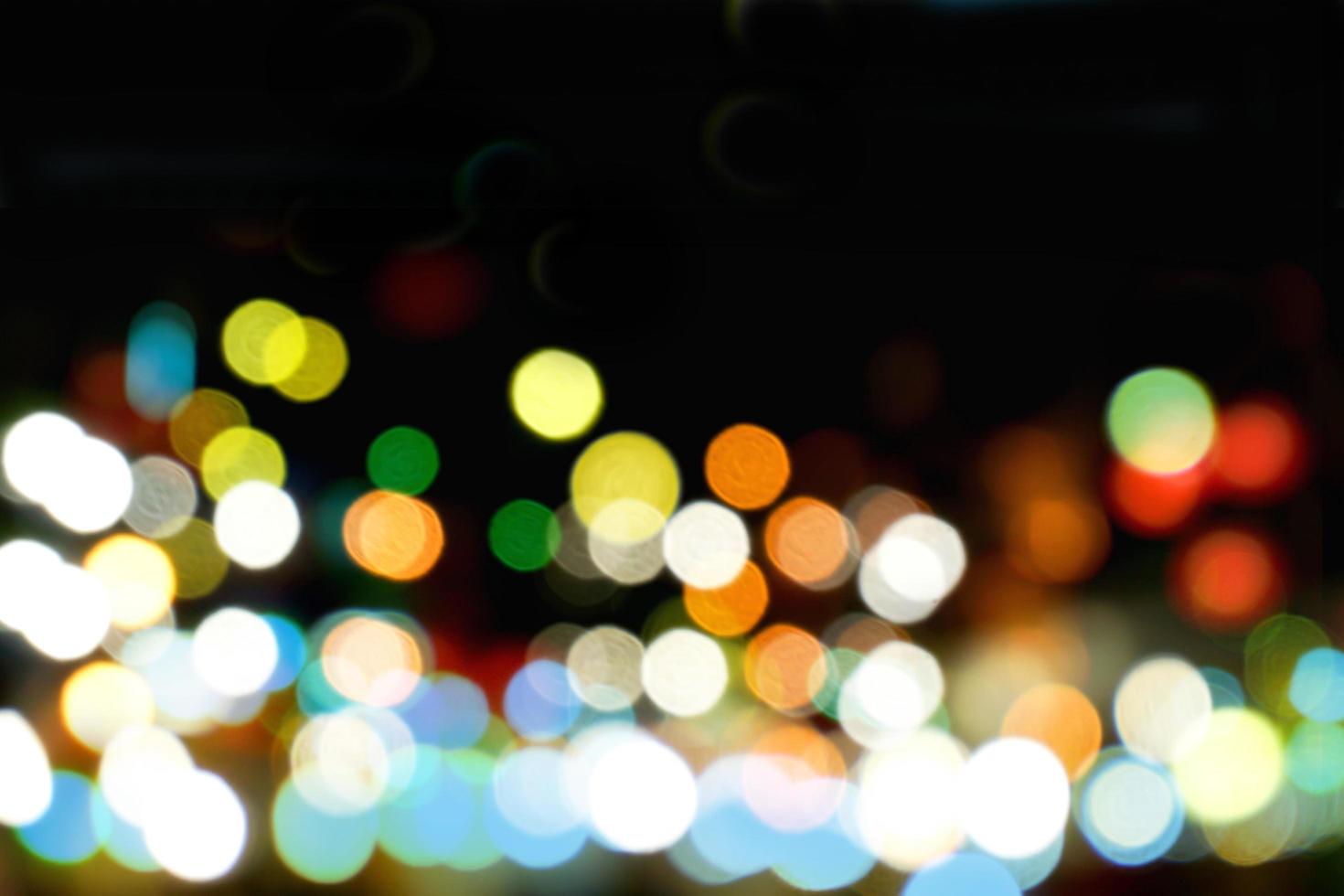 Abstract colorful bokeh and blurred reflection lighting on black background photo