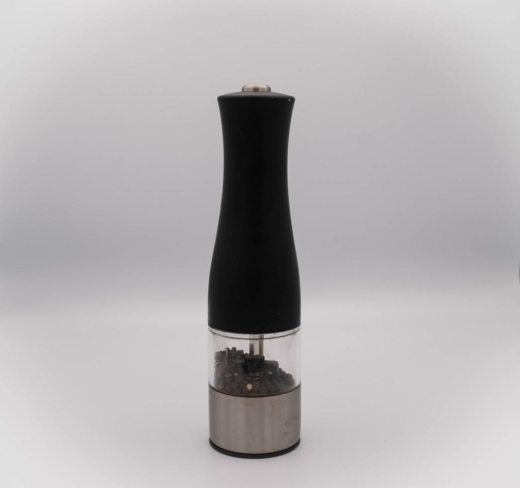 black electric pepper grinder, in an Italian kitchen during a typical Italian lunch photo