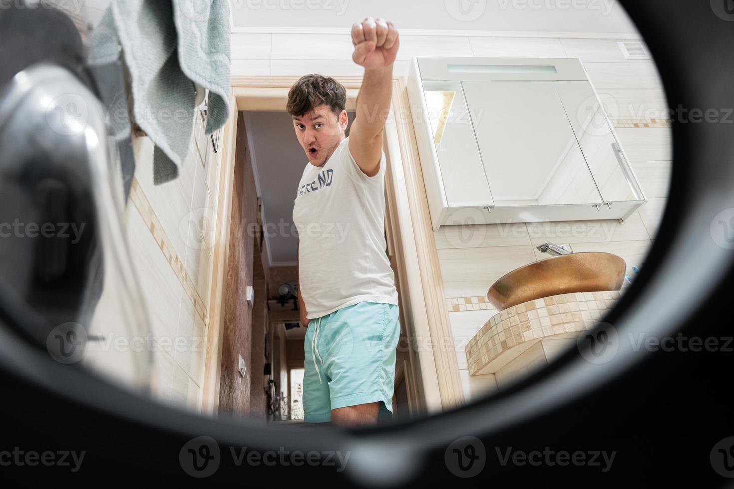 Man view from washing machine inside. photo