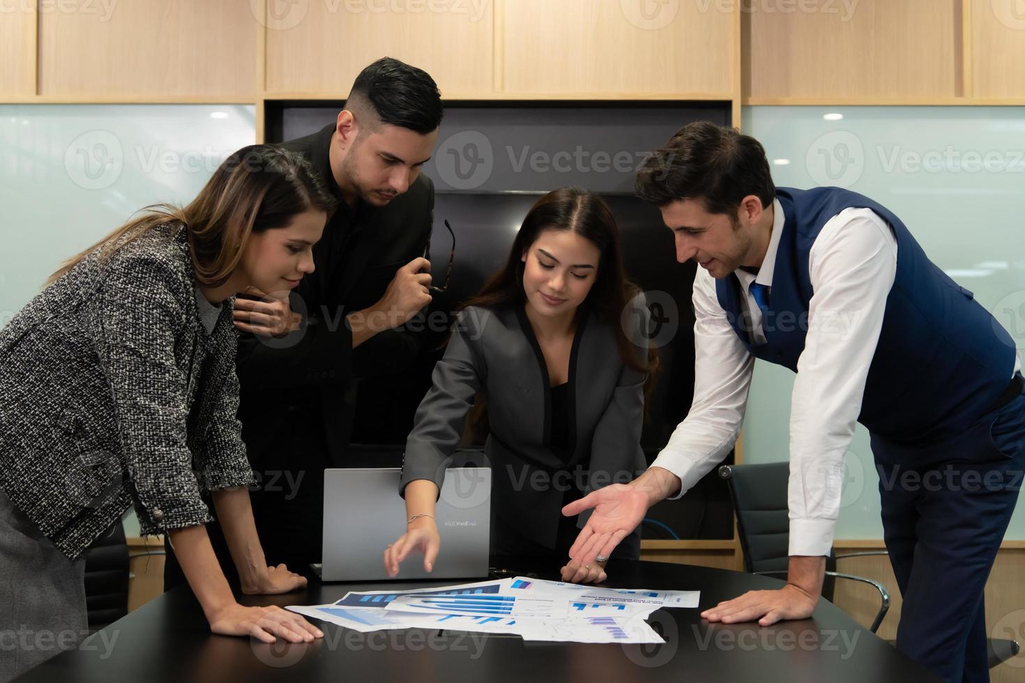 New business people in the conference room are exchanging information with each other along with rehearsing important information photo