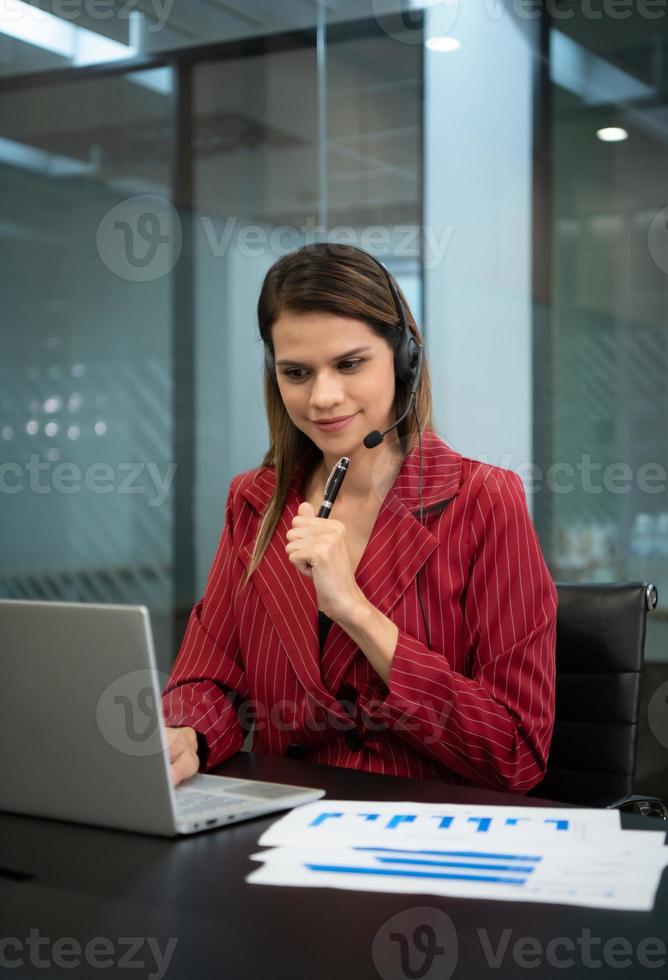 Young woman working at a call center which is a consultant for various information of customers who call to inquire or ask for advice photo