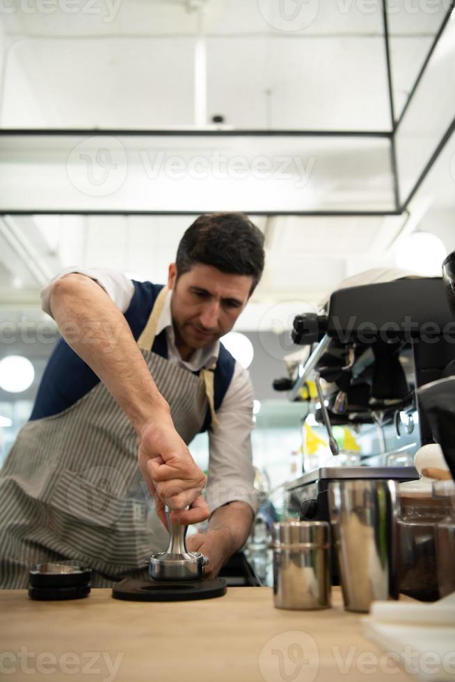 Coffee expert barista Making hot Americano for customers photo