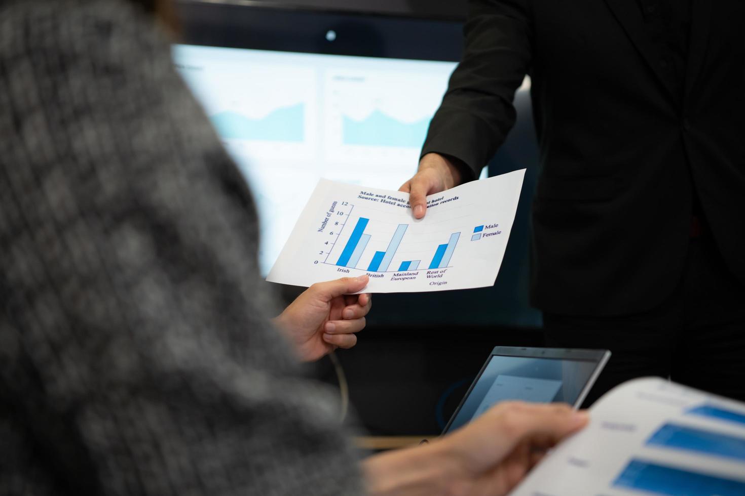 New business people in the conference room are exchanging information with each other along with rehearsing important information photo