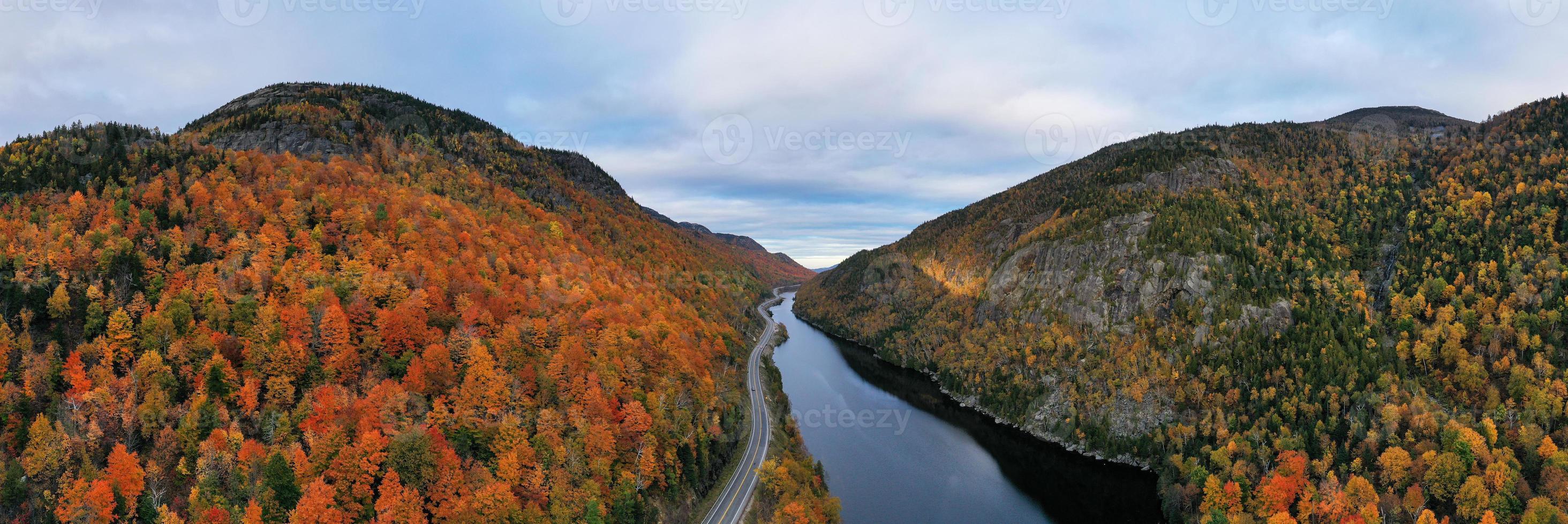 Peak fall foliage in Keene, New York by Cascade Lake. photo