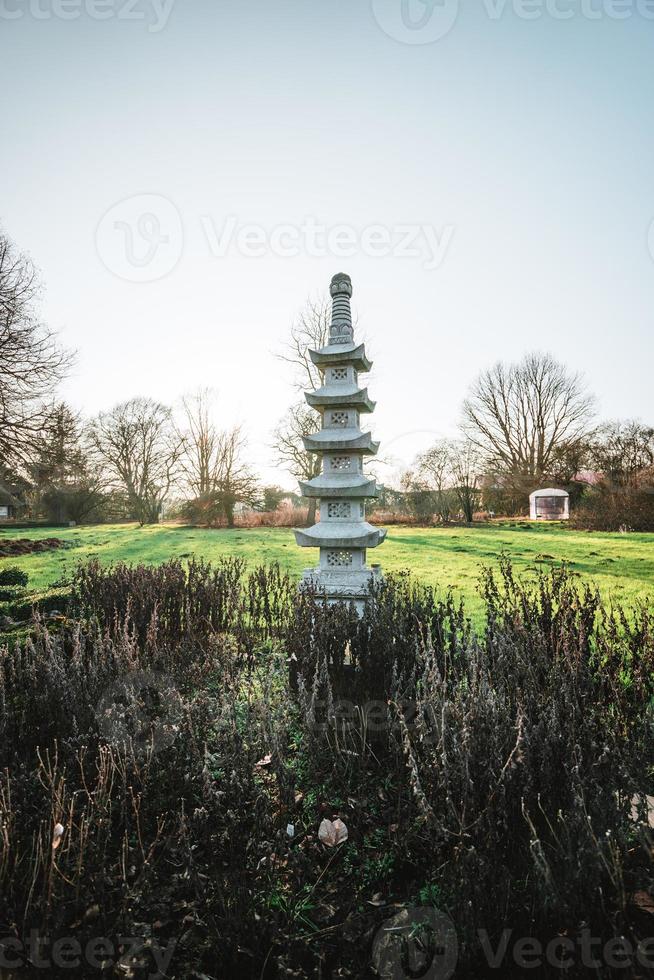 Japanese stone pagoda at a beautiful spring day photo