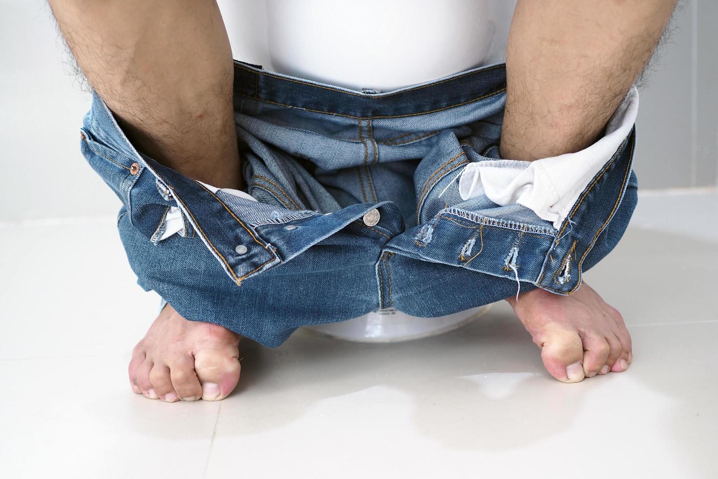 Men have abdominal pain. Want to shit. diarrhea concept photo